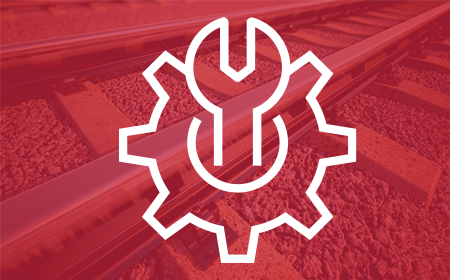 gear icon over red railroad tracks